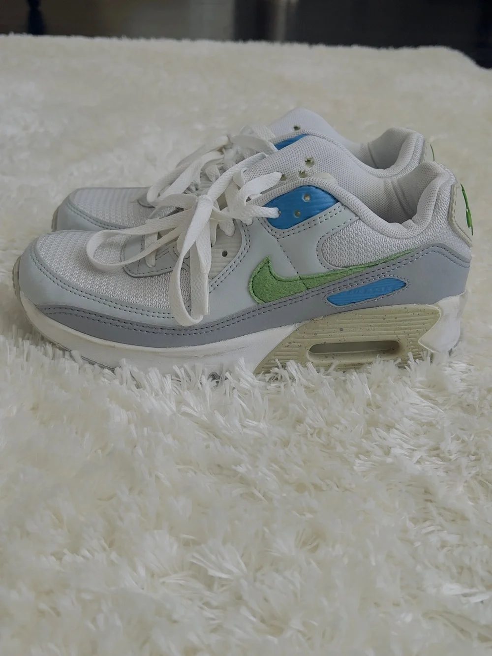 Nike Air Max 90 sneakers in white with blue and green accents